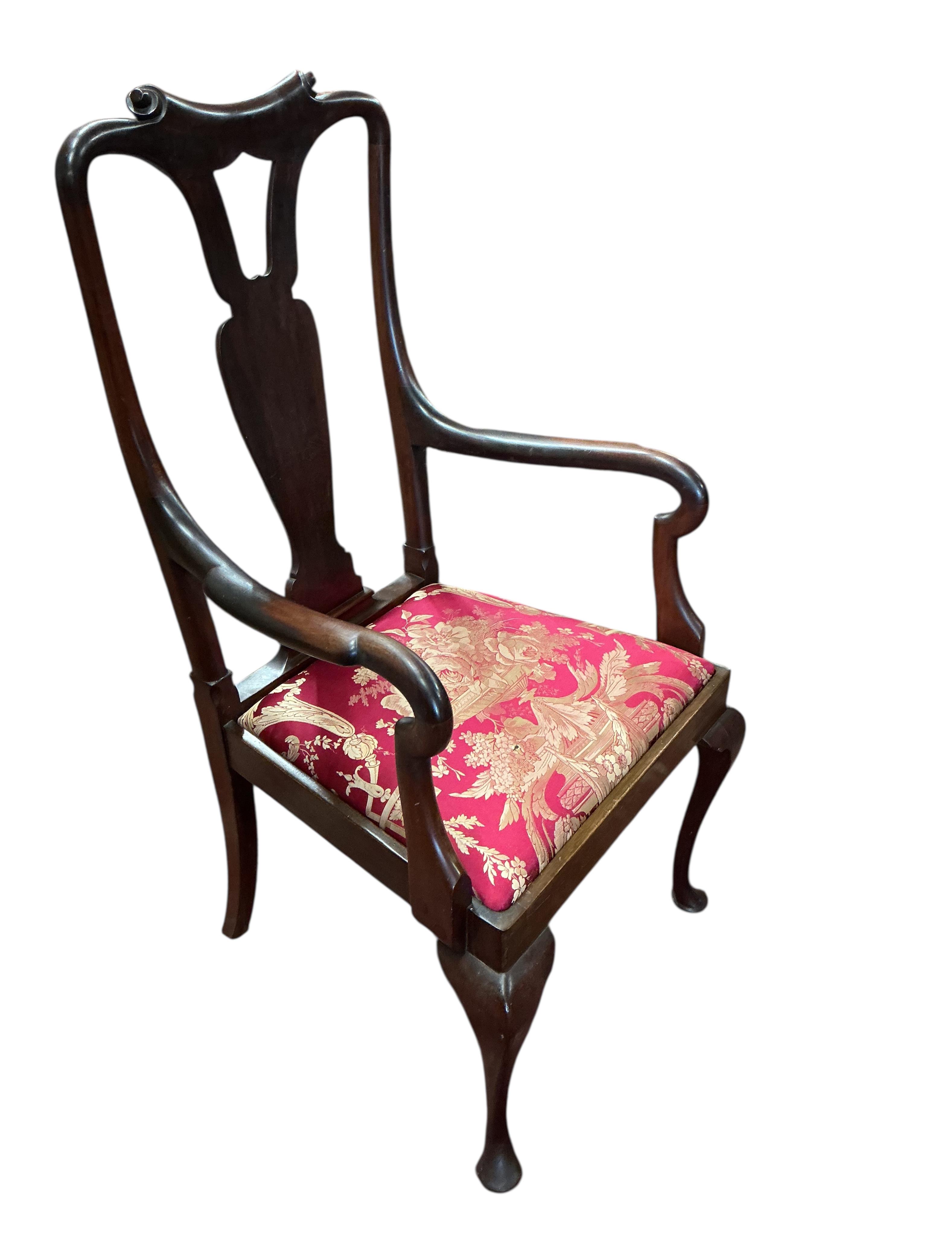 A set of eight early 20th century Queen Anne style mahogany dining chairs with silk brocade drop in seats, two with arms